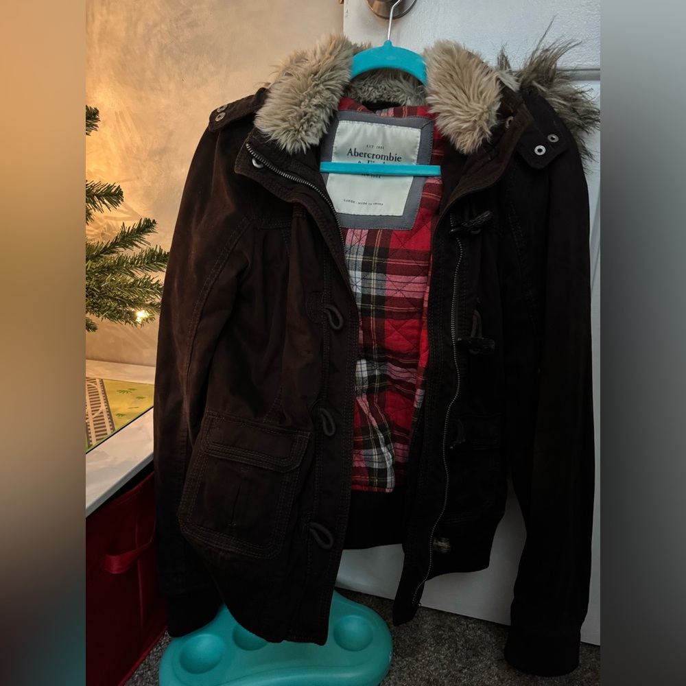 Abercrombie and fitch bomber jacket. Dark brown with red flannel inside.